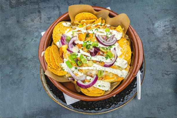 nachos chips on wooden background. top view.
