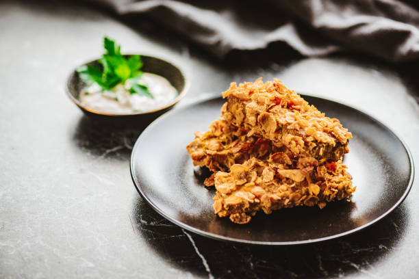 tofu sticks coated with cornflakes and yoghurt dip